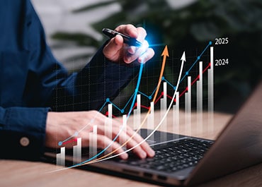 Virginia business succession planning with growth chart and laptop analysis